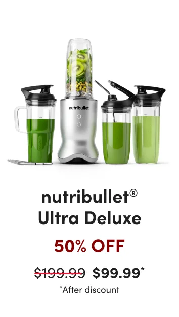 nutribullet pro 900 blender shown with a blending cup, green smoothie, and accessories.