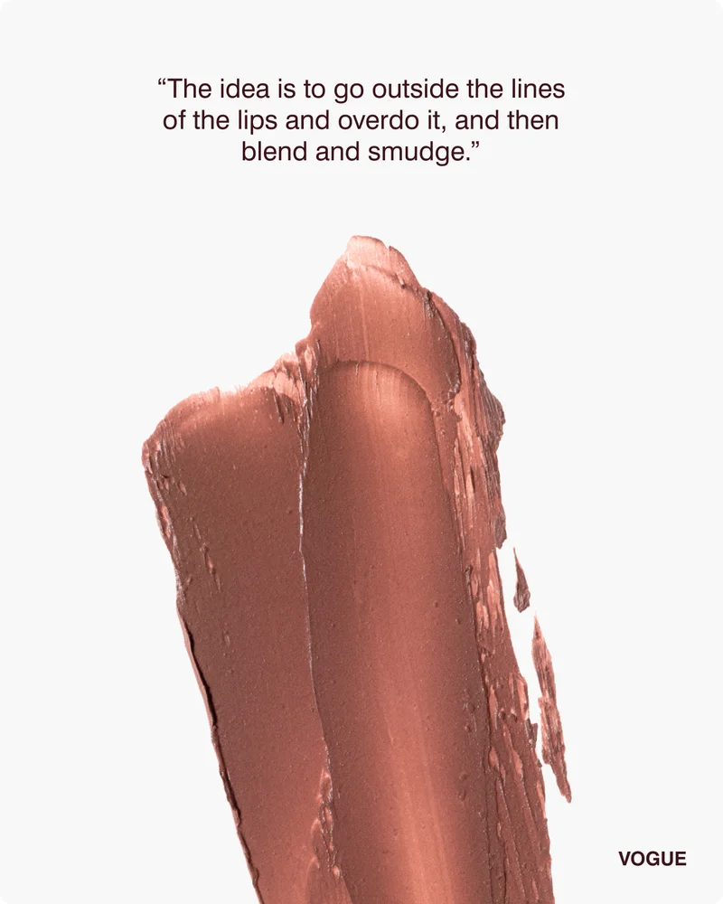 “The idea is to go outside the lines of the lips and overdo it, and then blend and smudge.”