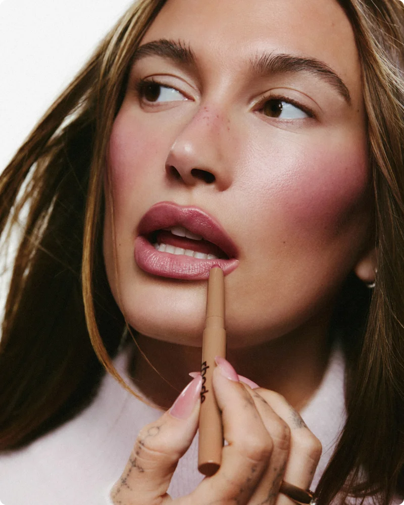 hailey bieber wears peptide lip shape in press