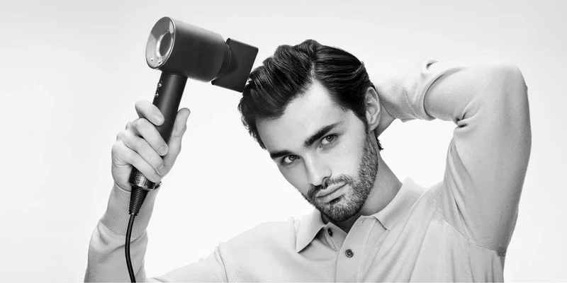 Man using Dyson Supersonic
