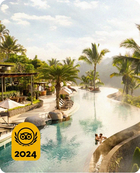 Image Description: Two people in an infinity pool in the jungle. A gold 2024 Travelers’ Choice Awards Best of the Best badge is on the bottom left corner of the image.