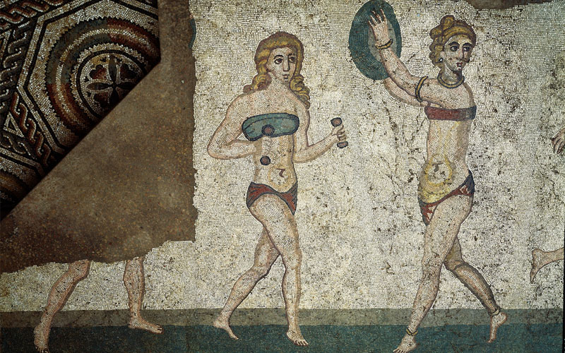 Roman women in a 4th-century mosaic from Sicily exercise while wearing an amictorium, a ancient bikini-type linen garment that bound the breasts. Scholars are divided on whether Greek and Roman women wore bra-like garments for support, style, or both.