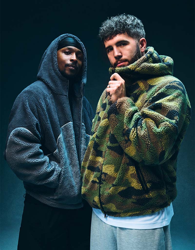 JME & Josh in wearing fleece hoodies. Shop Now