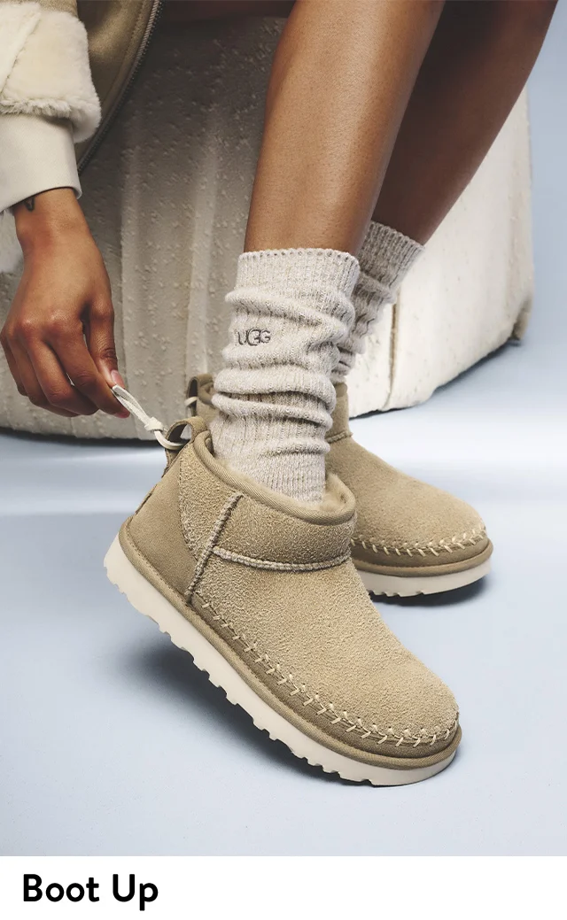 A woman wearing UGG booties.
