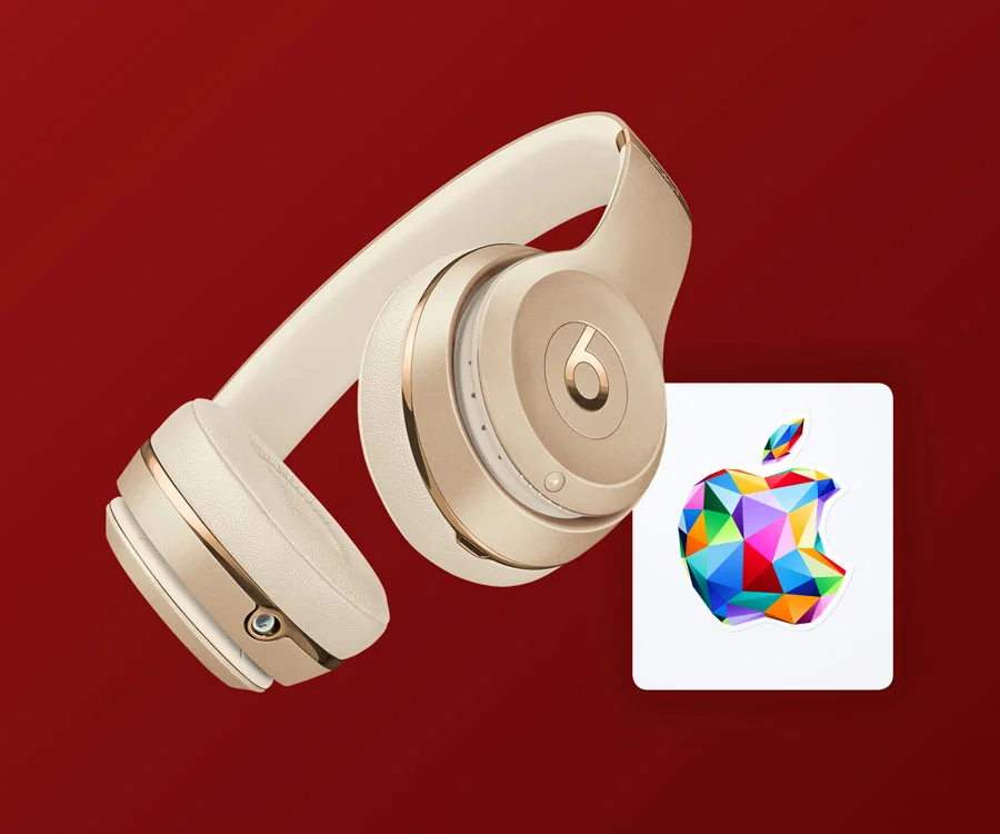 pair of Beats Solo3 Wireless headphones in gold with Apple Gift Card