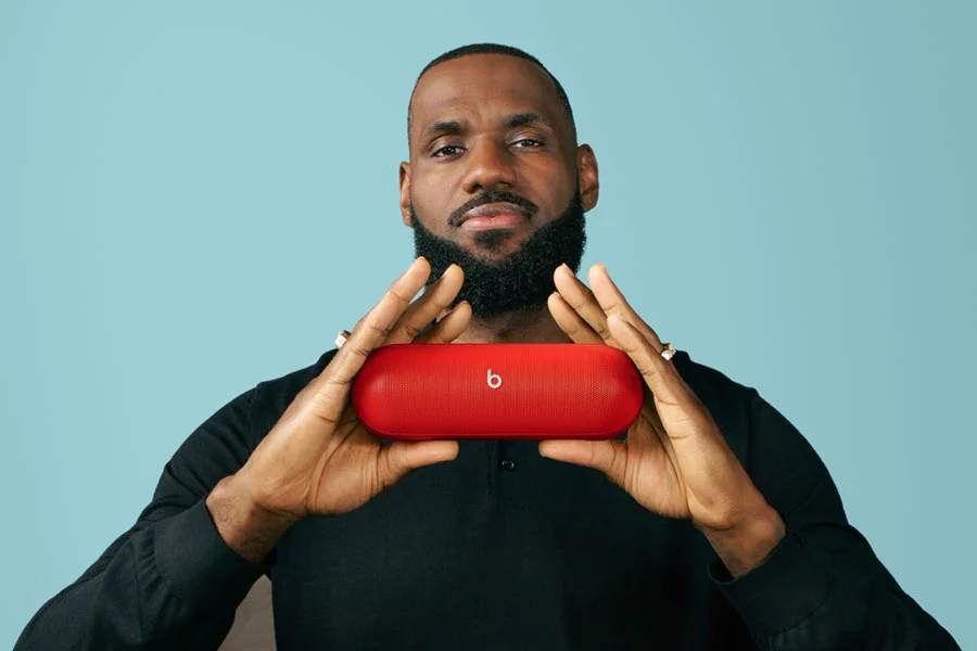 LeBron James holding the Beats Pill in Statement Red.