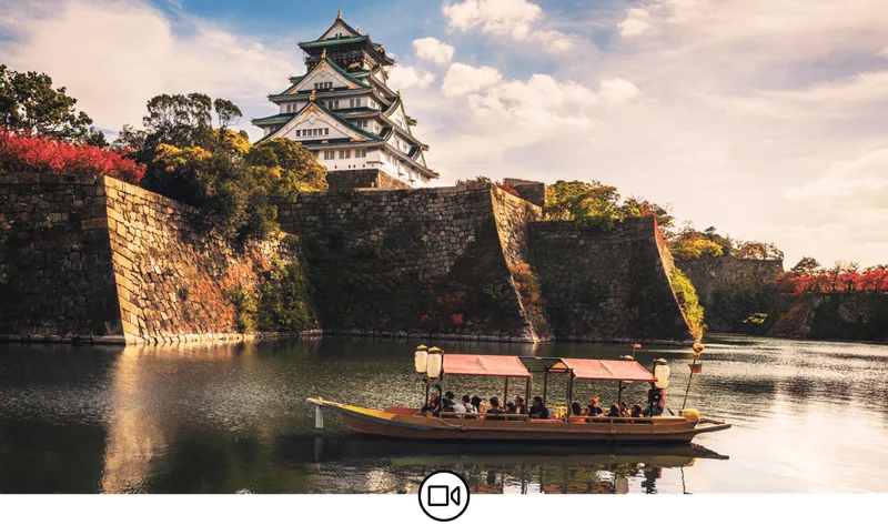 Image Description: Boats with tourists along the moat of Osaka Castle, Osaka, Japan