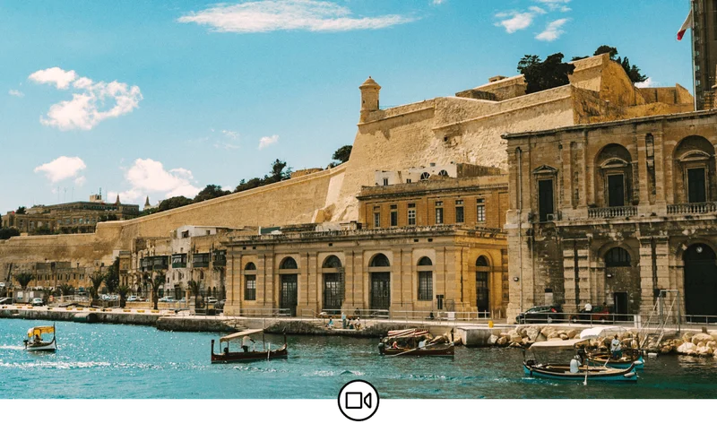 Image Description: The Valletta Waterfront, Floriana and the Old City of Malta seen from a boat.