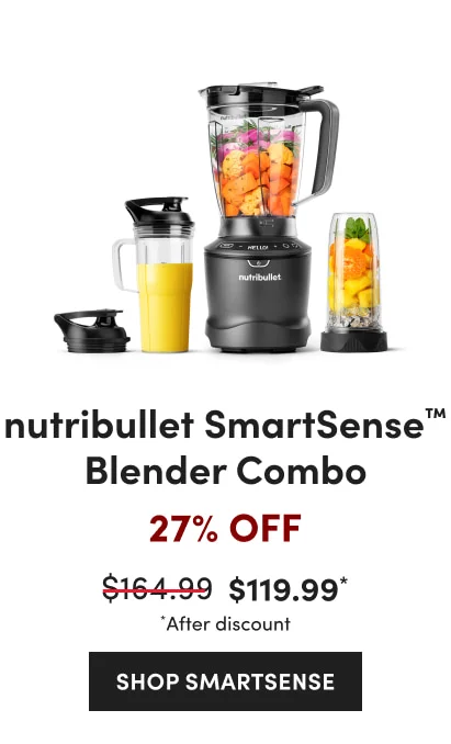 A nutribullet blender set with a black base, filled with fresh fruits and vegetables with a yellow smoothie cup and a cup with orange fruits.
