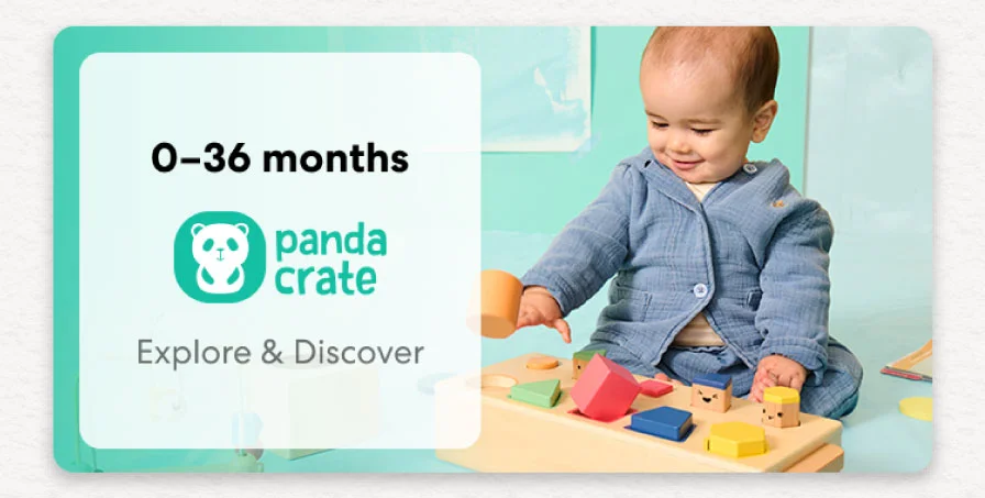 Baby playing with a KiwiCo Panda Crate toy. Designed for ages 0–36 months to explore and discover.