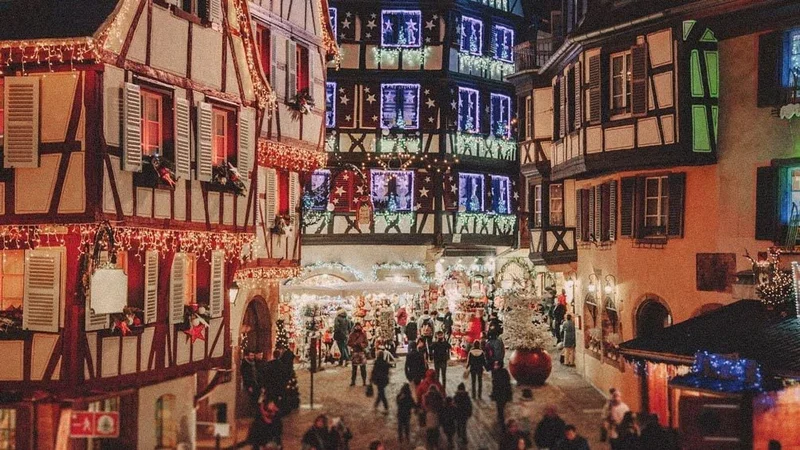 Image description: Nighttime view of Christmas market in Colmar, France.