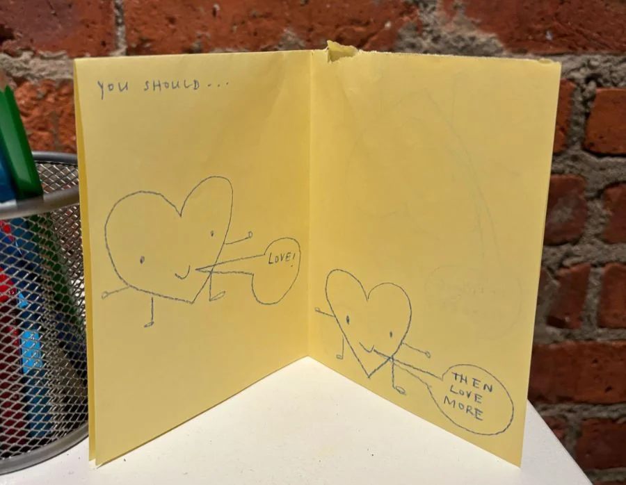 A photograph of a zine with hearts