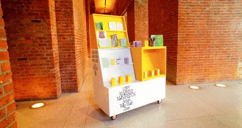 A GIF of photographs of a cart full of zines