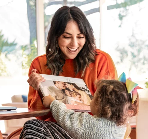 Child showing adult a Mixbook