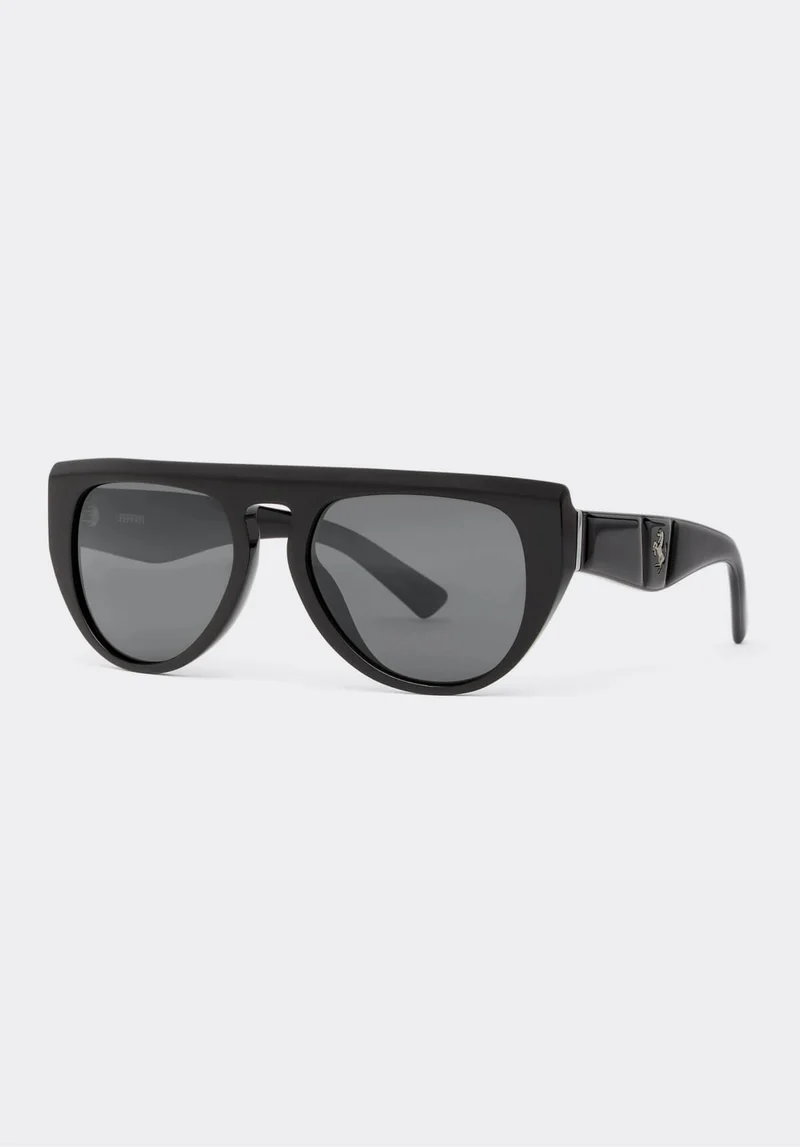 Selection of Ferrari accessories: wallets, caps, eyewear and shoes