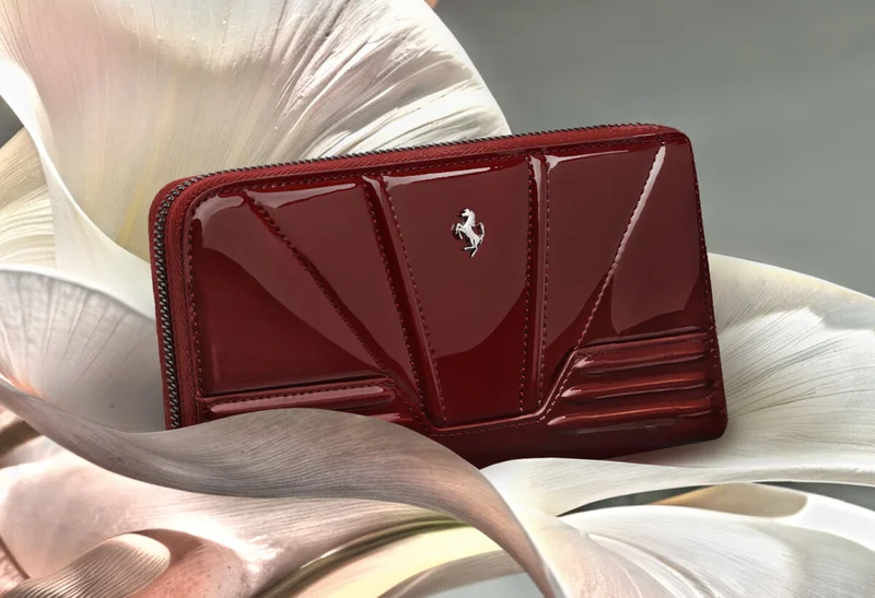 Shiny patent-leather wallet with raised motifs and the Prancing Horse