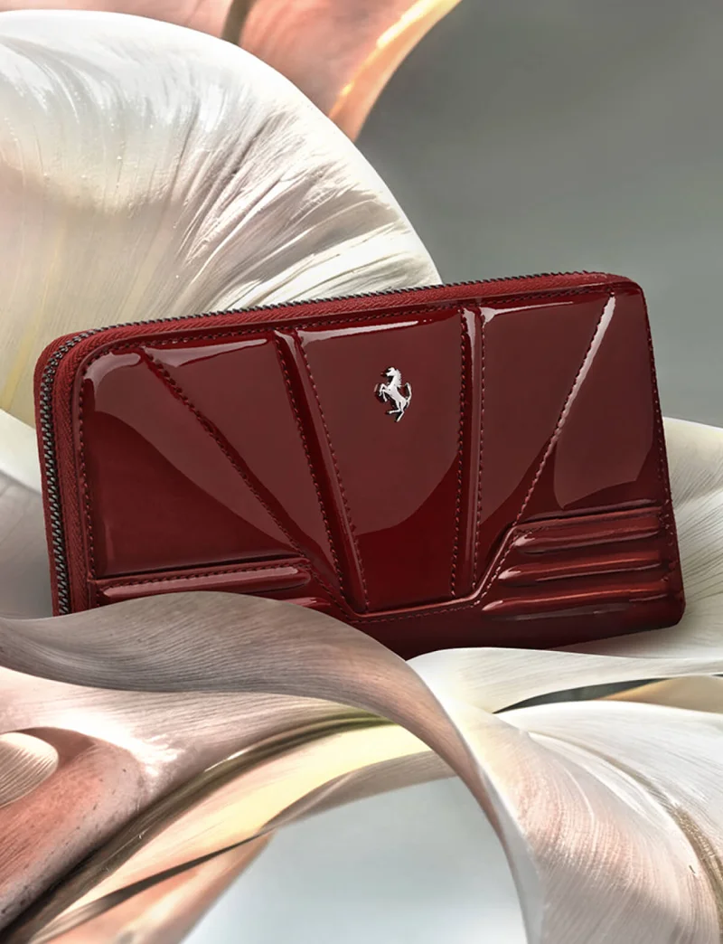 Shiny patent-leather wallet with raised motifs and the Prancing Horse