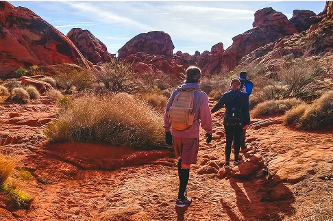 Image Description: Two people hiking in the desert.
