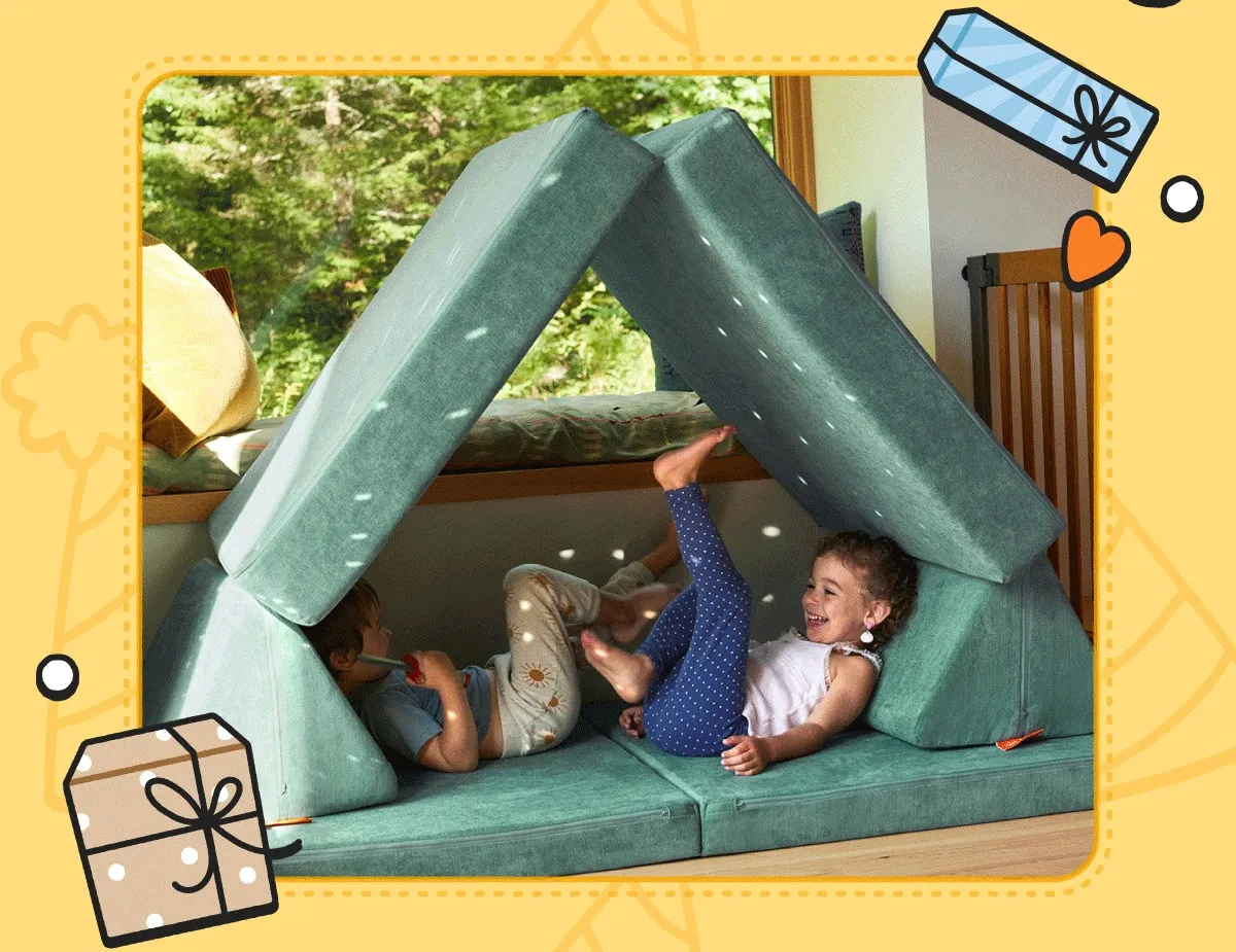 Two children play in a fort made from their Seamonster Nugget