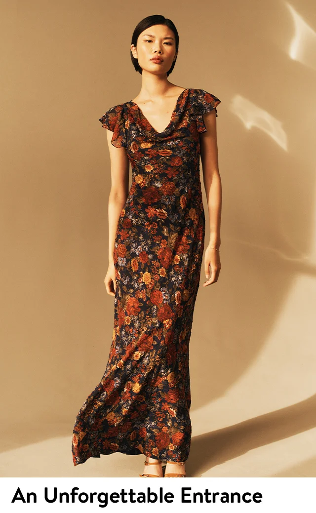 A woman wearing a ruffled floral dress.