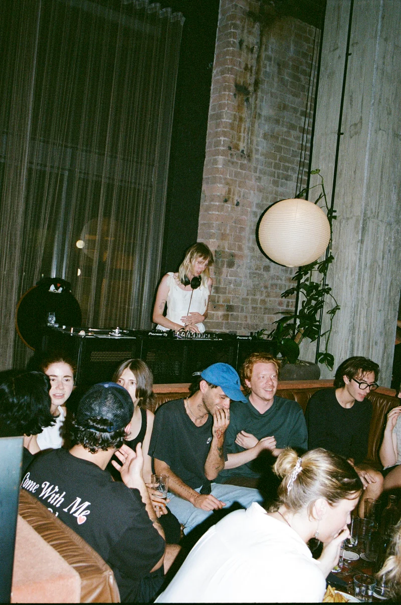 a dj spinning at the lobby of ace hotel sydney