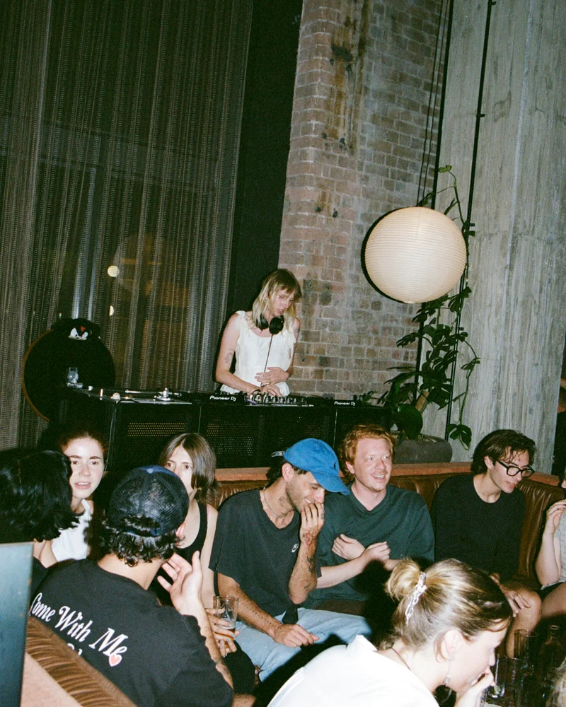 a dj spinning at the lobby of ace hotel sydney
