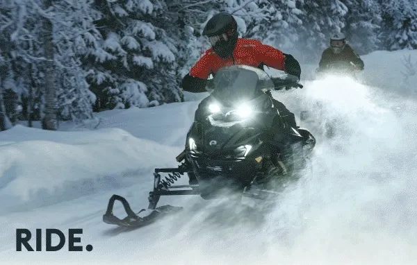 Lynx riders with their snowmobiles