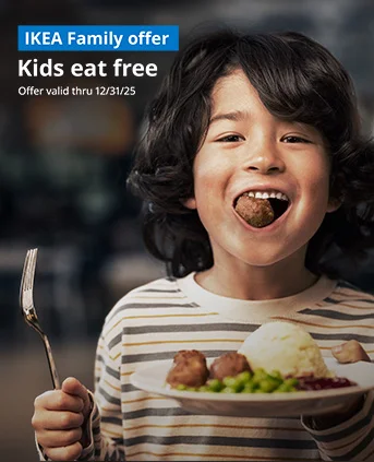 Kid holding a plate of meatballs and one in their mouth