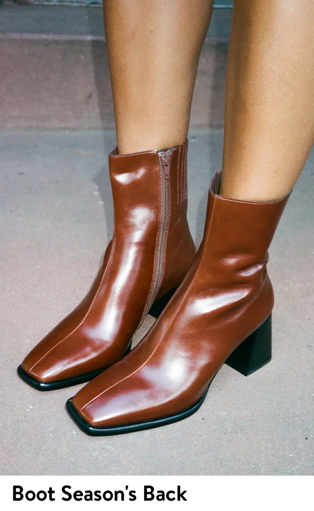 A woman wearing brown boots.