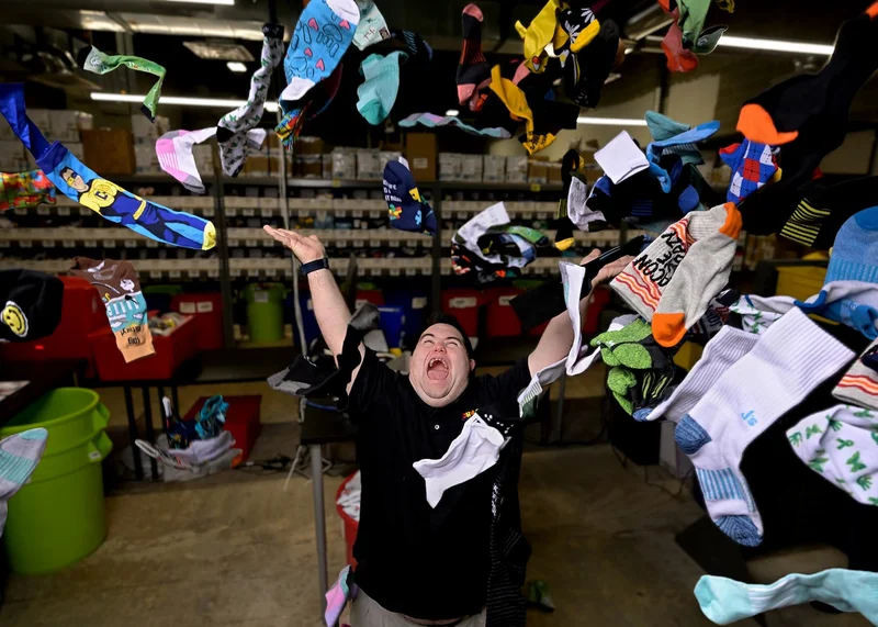 John throwing socks in the air in celebration