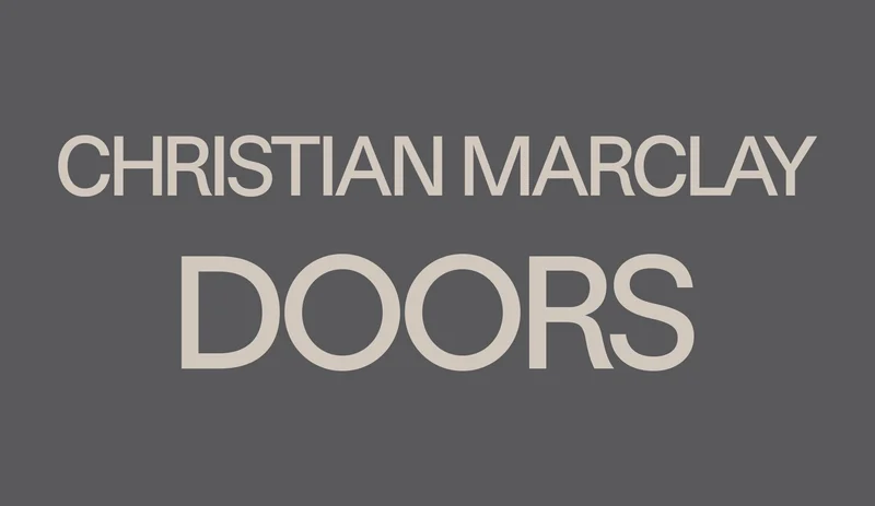 Gray text that reads “Christian Marclay Doors”