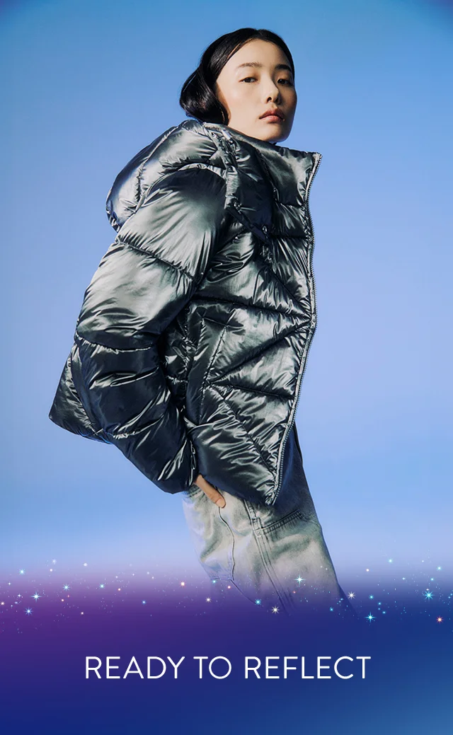 A woman wearing a shiny puffer jacket.