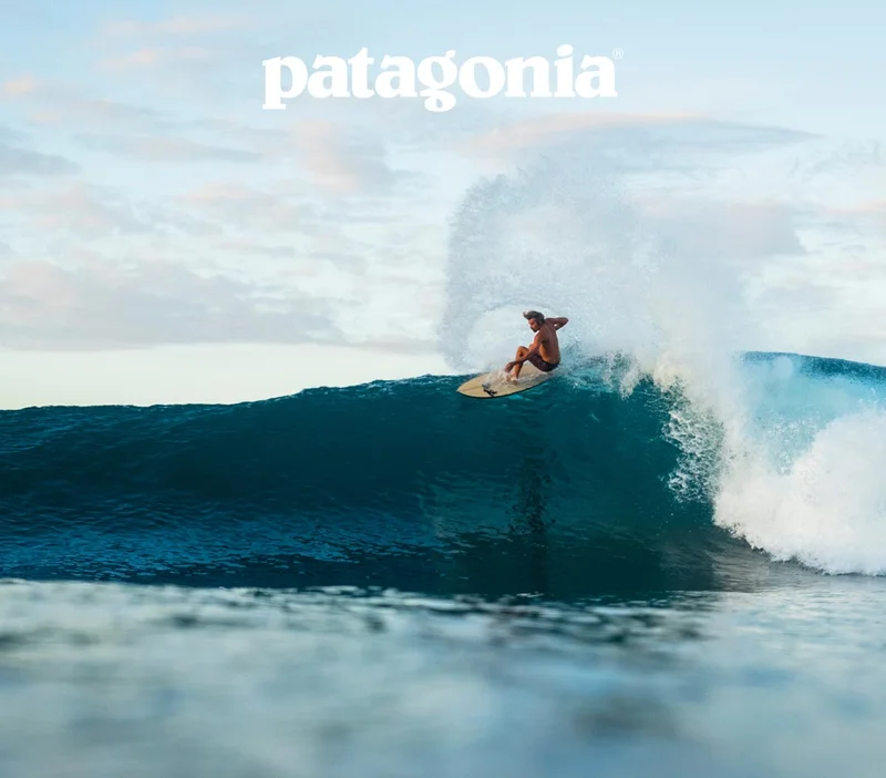Patagonia. A surfer makes a top turn on a tropical wave.