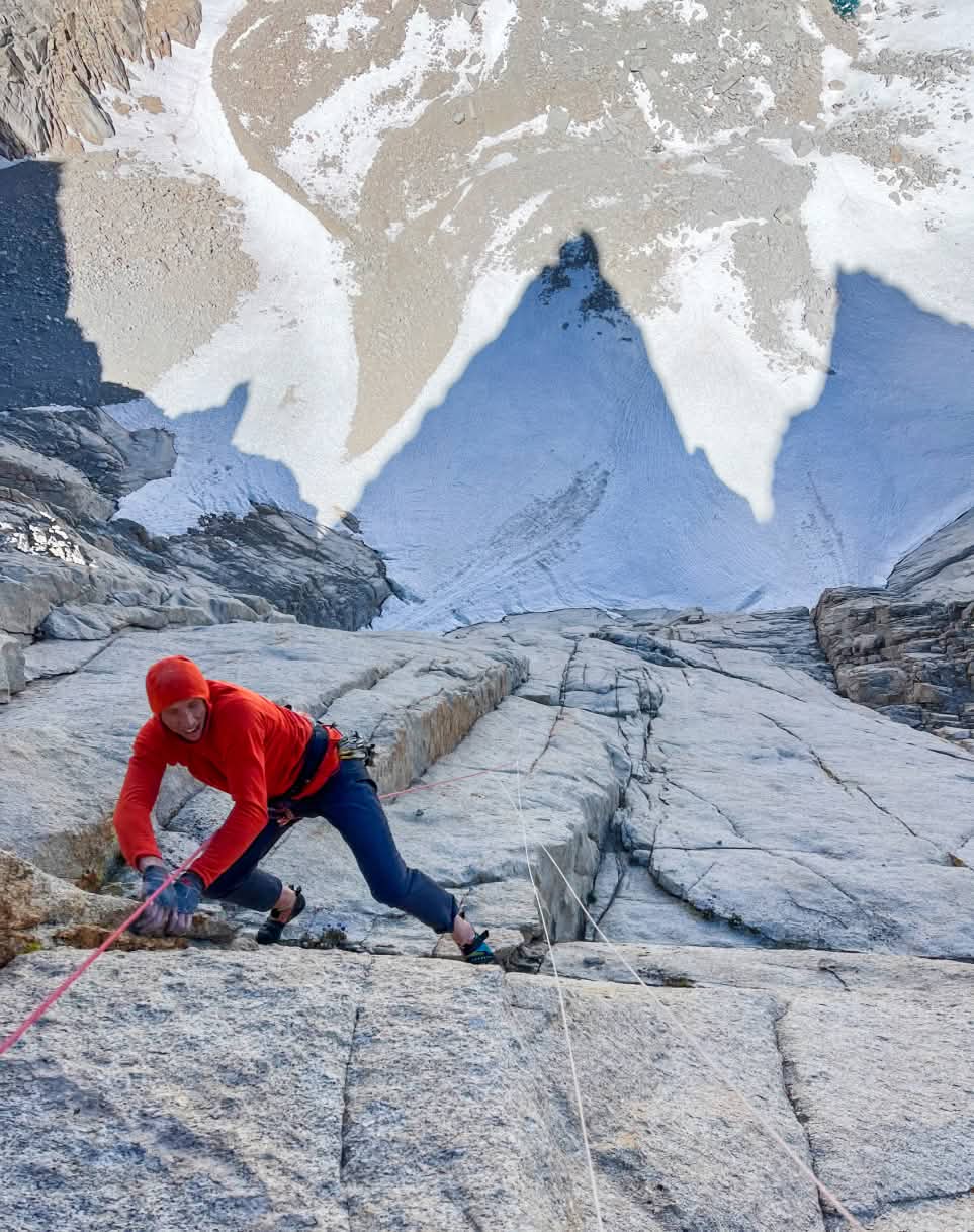 Looking down on a climber using the fix and follow technique high on a big wall.