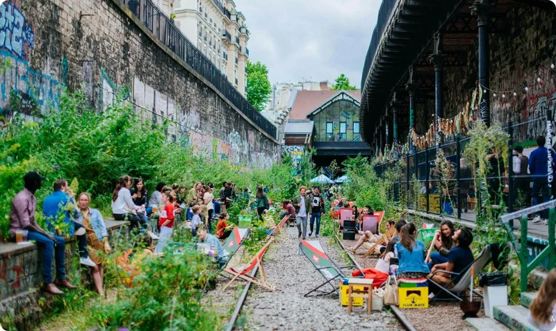 People gather on the terrace of Le Hasard Ludique, Paris, France