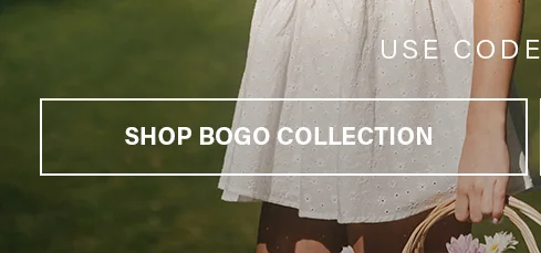 Woman in a white eyelet dress holds a wicker flower basket. Discover our discount code collection & shop buy one get one free deals!