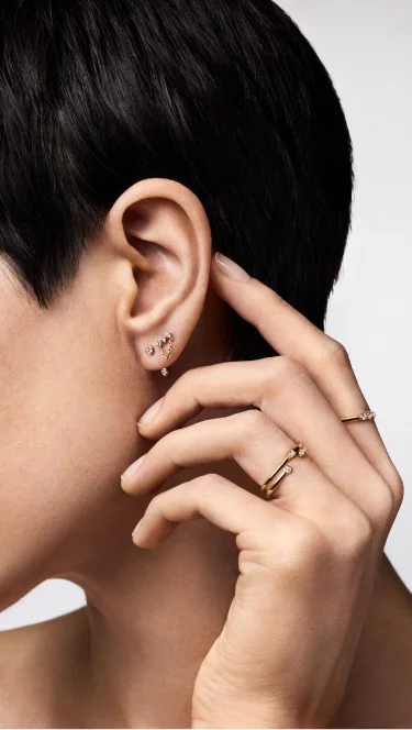 Model wears prong-set lab-grown diamonds Model wears prong-set lab-grown diamonds