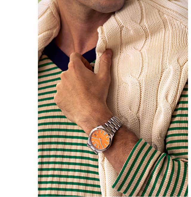 Man wearing an orange dial TSUYOSA