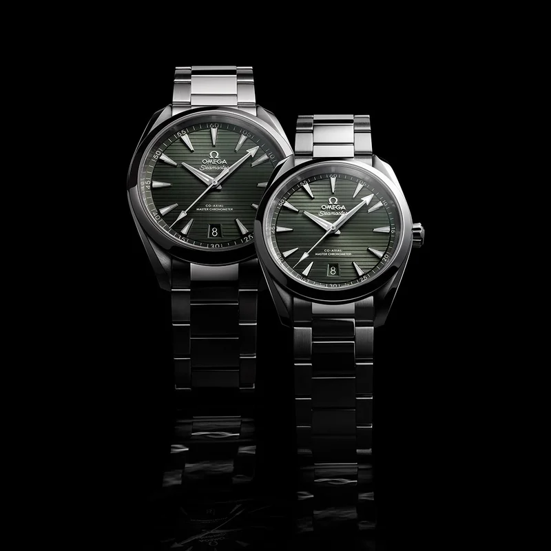 Two Seamaster Aqua Terras on a dark background.
