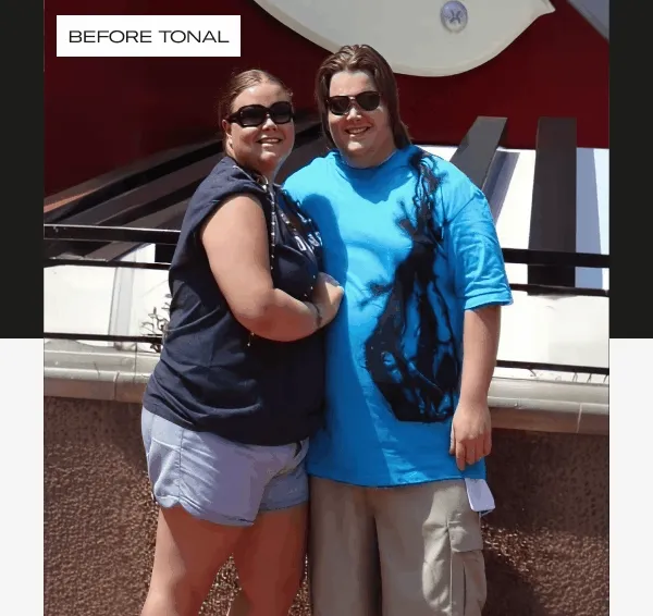 A gif of a man and a woman in front of a mirror.