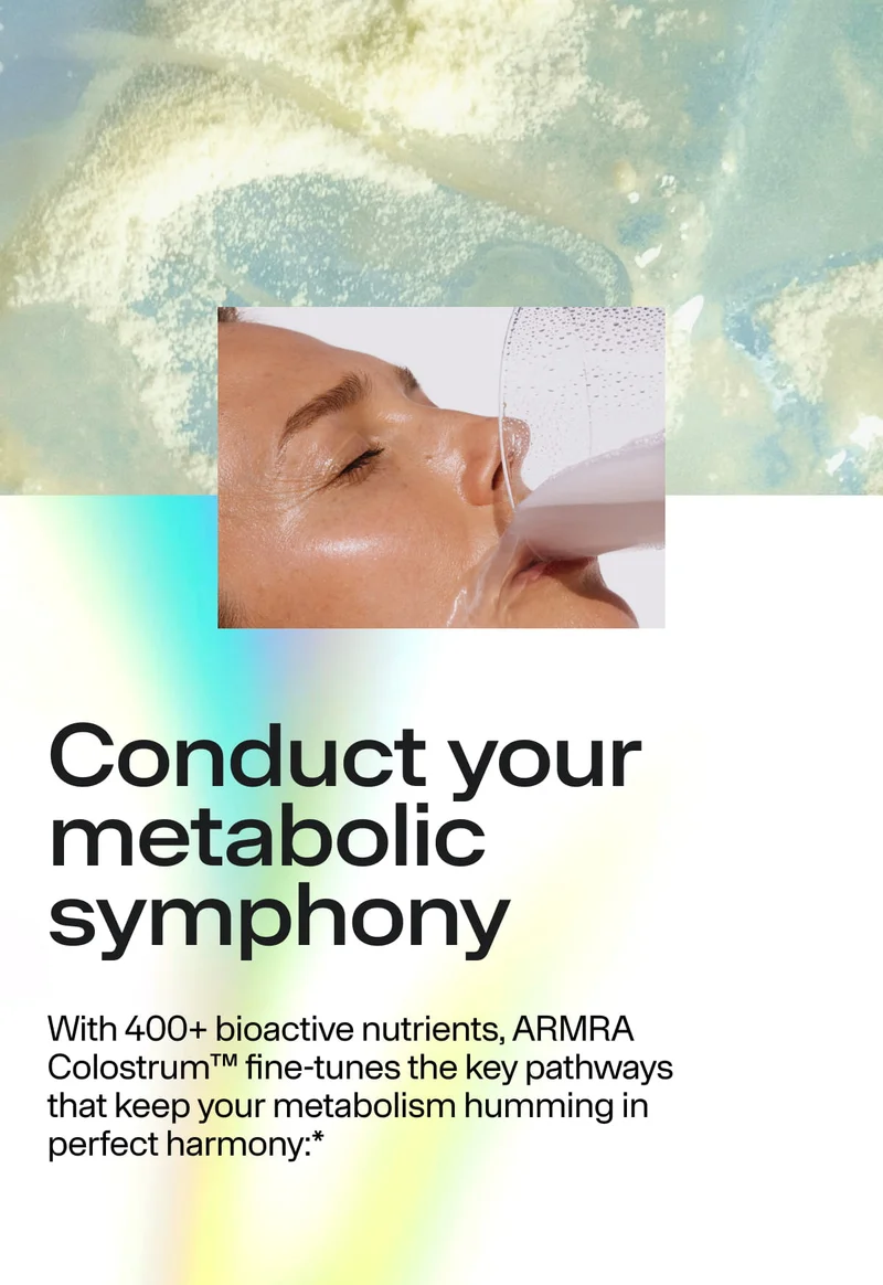Conduct your metabolic symphony. With 400+ bioactive nutrients, ARMRA Colostrum™ fine-tunes key pathways that keep your metabolism humming in perfect harmony.* Close-up of a person drinking a light-colored beverage from a glass.
