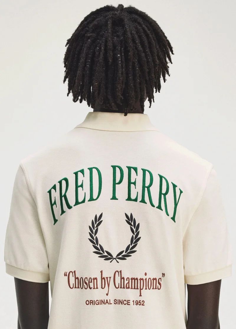 Men's ecru polo embroidered with the words "chosen by champions"