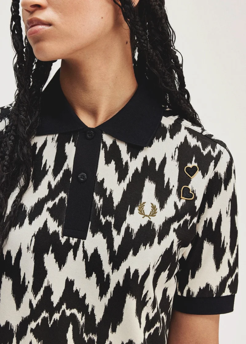 Animal-inspired women's polo shirt in black and white pattern
