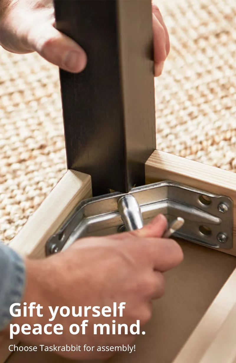 Person building a desk leg