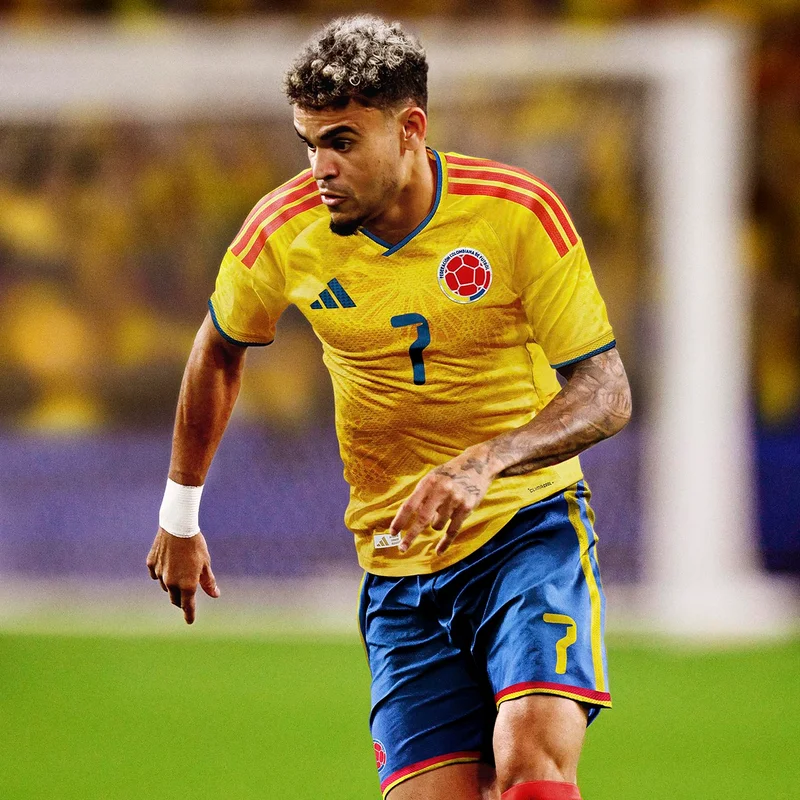 Male playing soccer in colombia home jersey