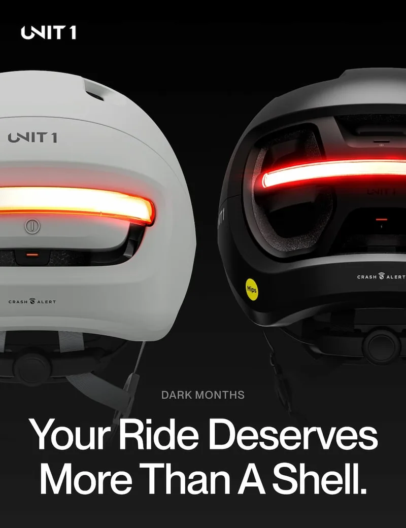 Close-up of UNIT 1 Smart Light Pro Dual with red rear beam for night visibility.