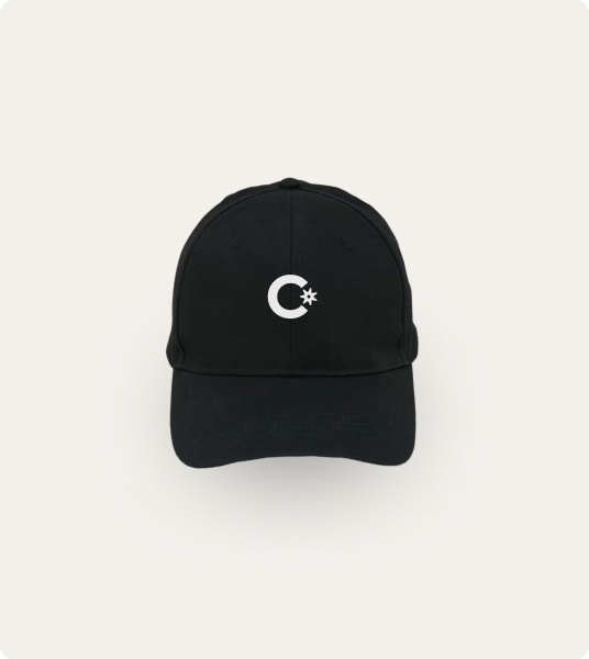 A photograph. A black cap with the Cowboy logo on the front.
