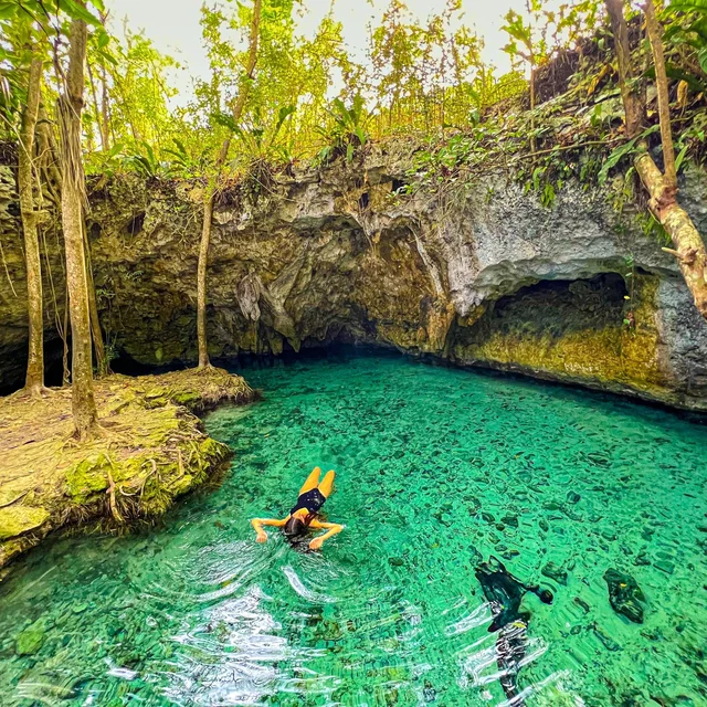 Woman swimming in Tulum Cenotes