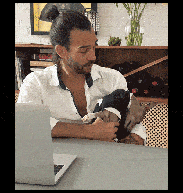 Gif of Finn the dog looking up at Randall, Finn's co-founder, at a table
