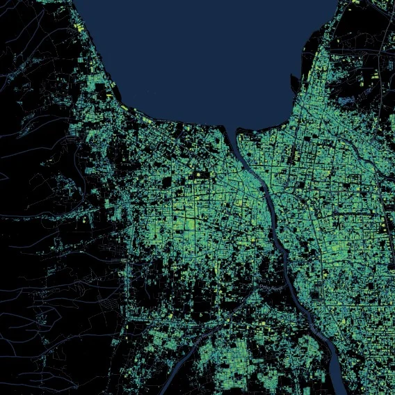 A satellite image of a city illuminated at night